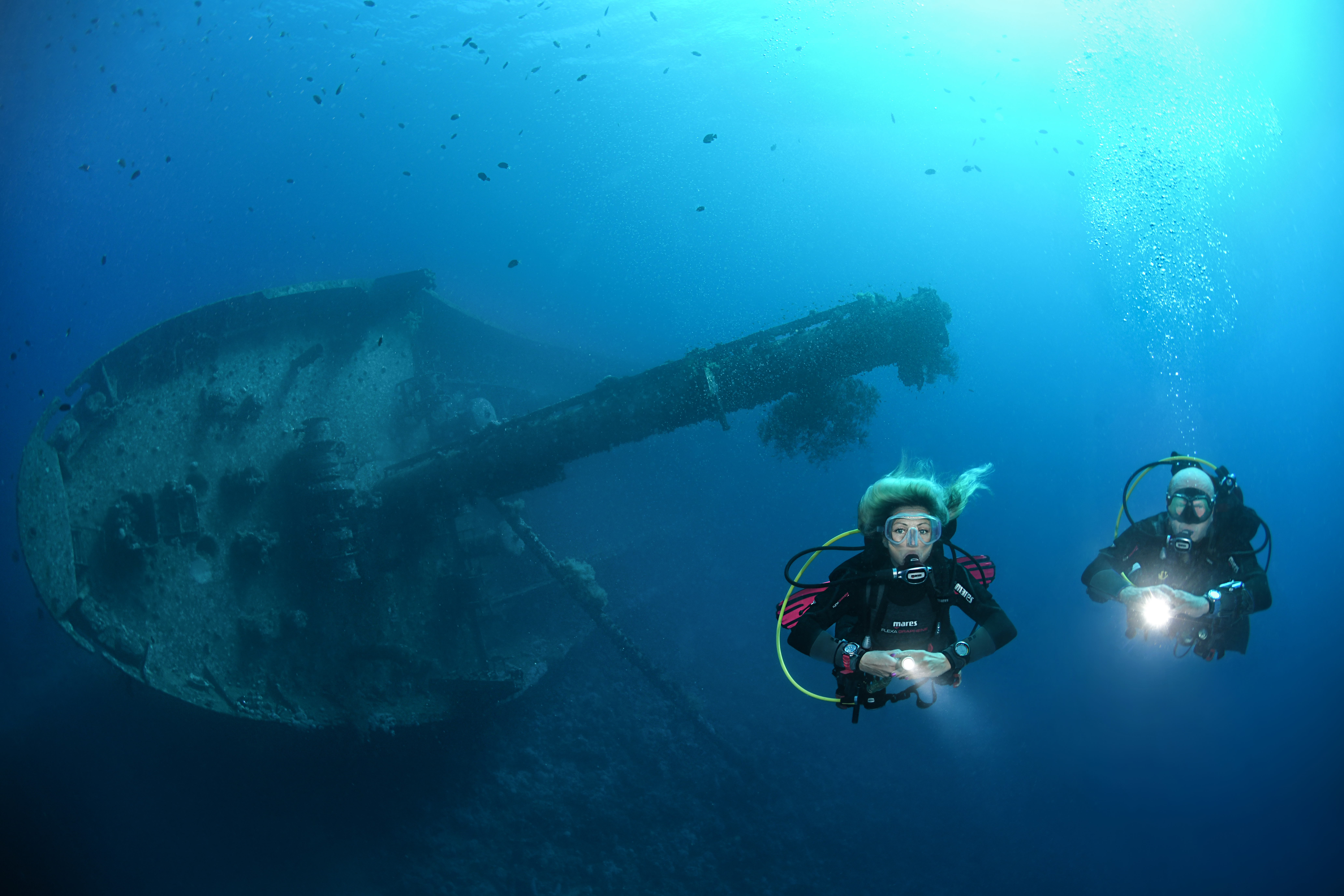 Image of Deep Scuba Divers with wreck in backround